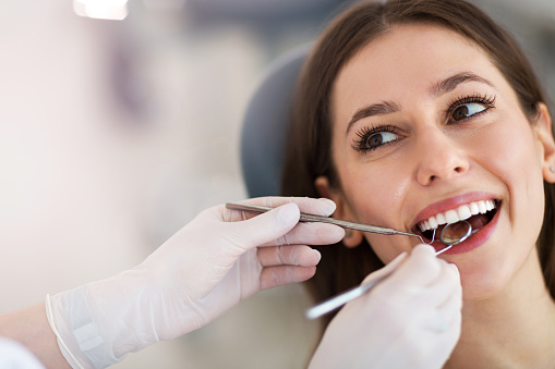 A woman with tooth decay gettin an exam at Lincoln Center Smiles in Portland, OR